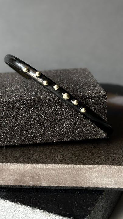 Pulsera Negro Dorado - BRONCE